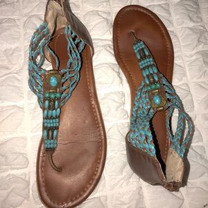 Brown and turquoise sandals.